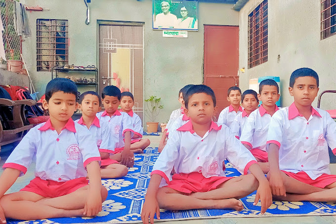 Children receiving school kits